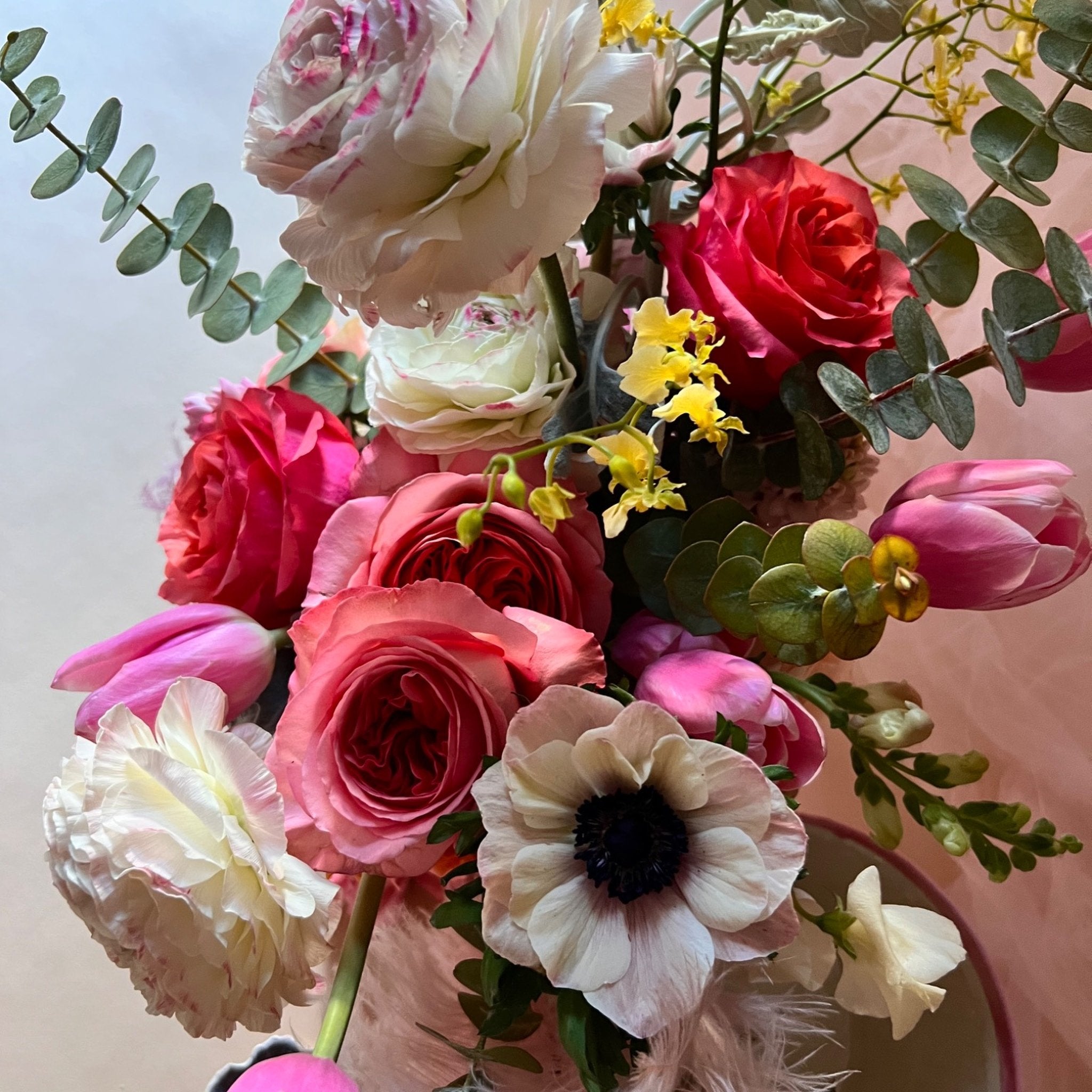 Close-up of romantic roses, white ranunculus, pink tulips, and anemone flowers - Ora La Casa de Las Flores
